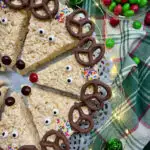 Reindeer Rice Krispie Treats plated with string lights and a plaid towel