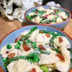 bowls of asparagus bacon and pea tortellini pasta