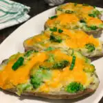 Broccoli Cheddar Twice Baked Potatoes on a white plate