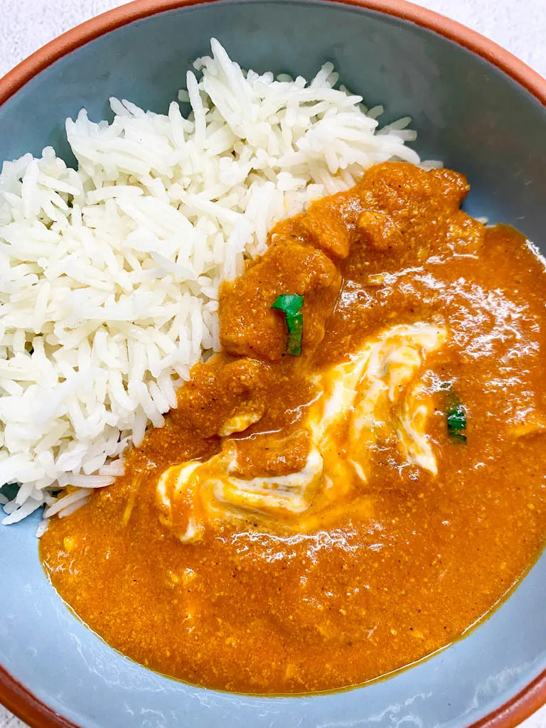 bowl of butter chicken with rice