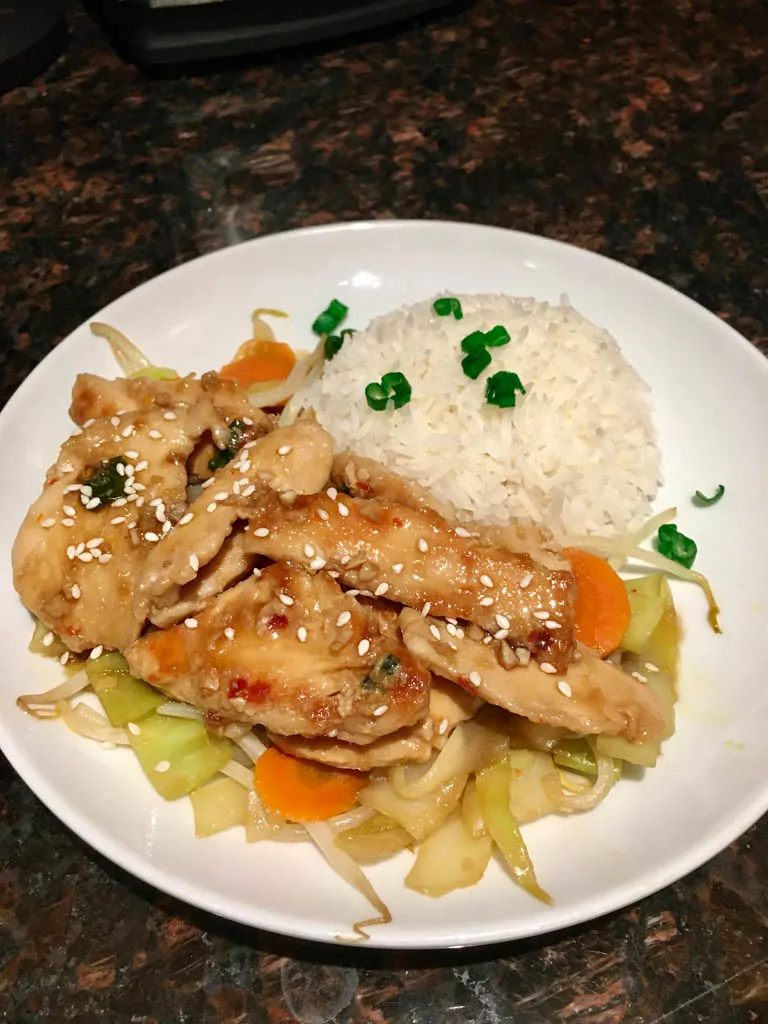 teriyaki chicken stir fry served on a white plate