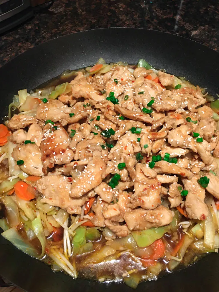 teriyaki chicken stir fry served in a large wok