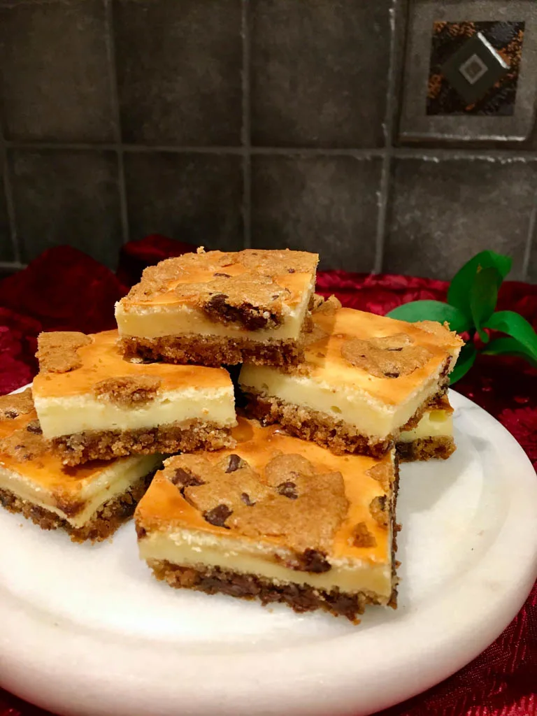 Cookie Dough Cheesecake Bars on a white plate