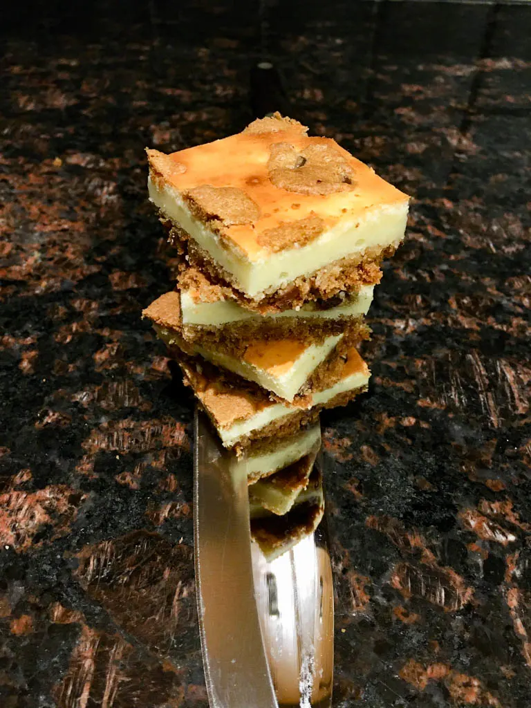 Cookie Dough Cheesecake Bars on a white plate