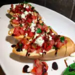 Feta Bruschetta on a white plate