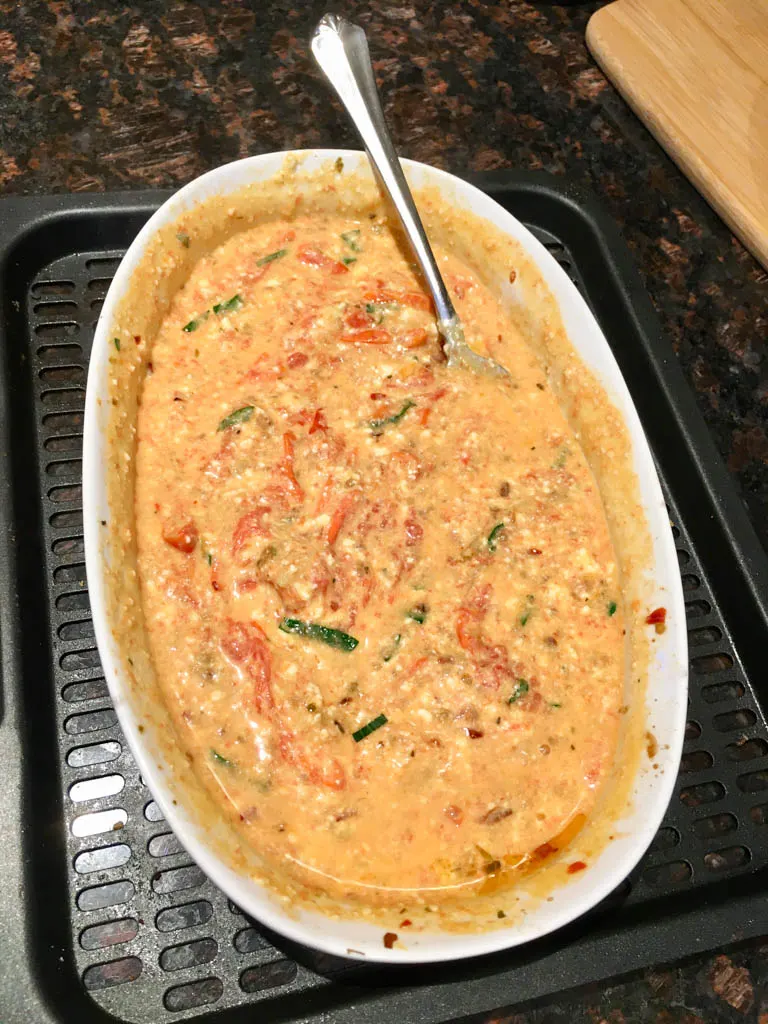 feta tomato sauce in a white baking dish