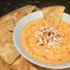 Feta Roasted Red Pepper Dip in a white bowl with pita