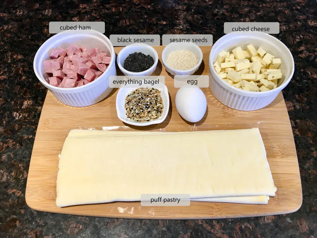 ingredients to make Ham and Cheese Puffs on a wood board