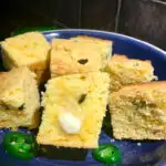 Jalapeno Cheddar Corn Bread on a blue plate