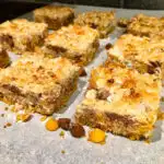 Magic Bars 8 Layer bars on parchment paper