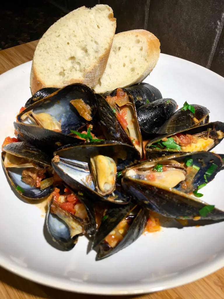 Mussels Portuguese Spicy Chorizo plated with baguette