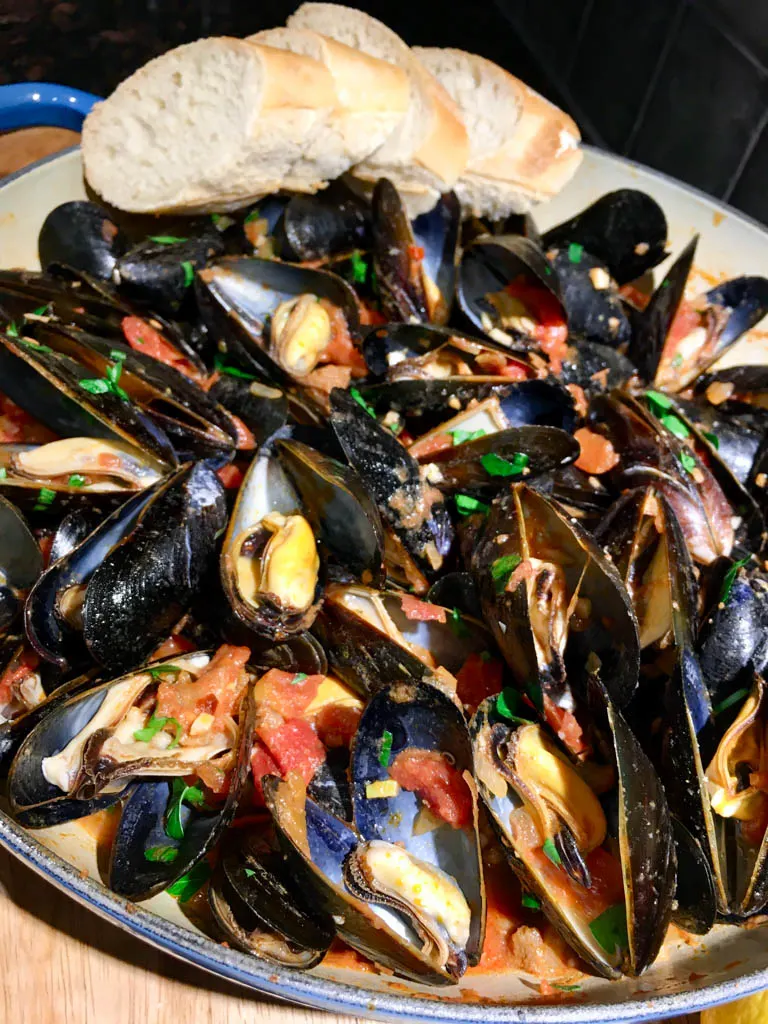 Mussels Portuguese Spicy Chorizo plated with baguette