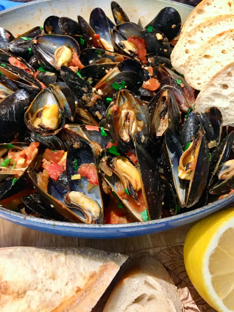 Mussels Portuguese Spicy Chorizo plated with baguette