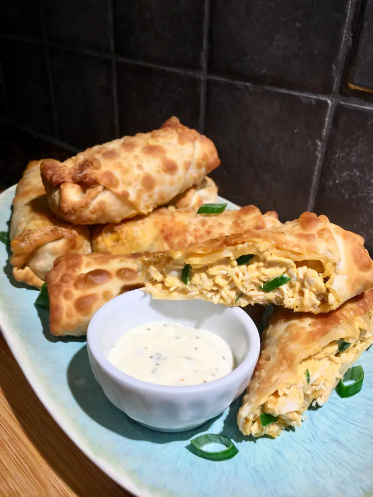 Piri Piri Chicken Egg Rolls on a blue plate