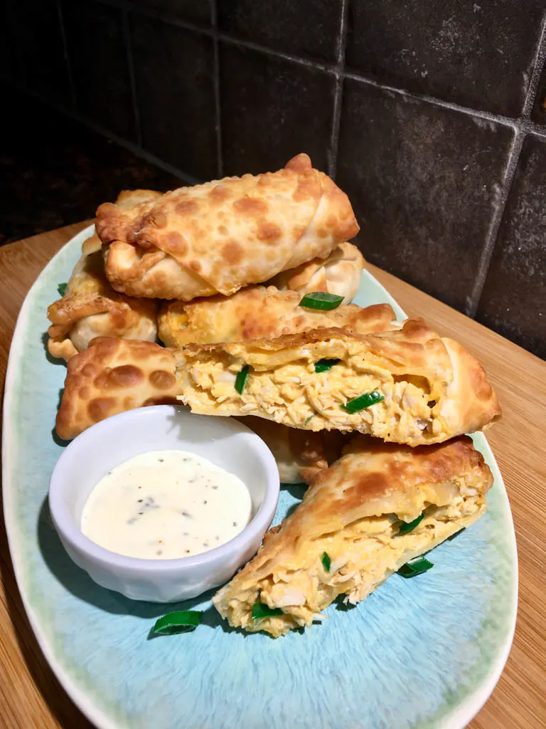 Piri Piri Chicken Egg Rolls on a blue plate