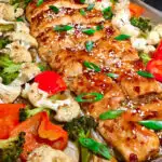 teriyaki salmon on a sheet pan with veggies