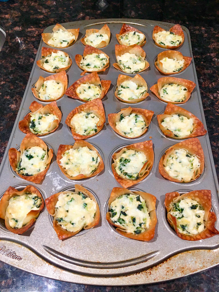 Spinach Artichoke Dip Wonton Cups baked in a mini muffin tin