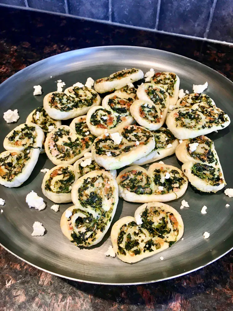 spinach feta palmiers on a metal plate