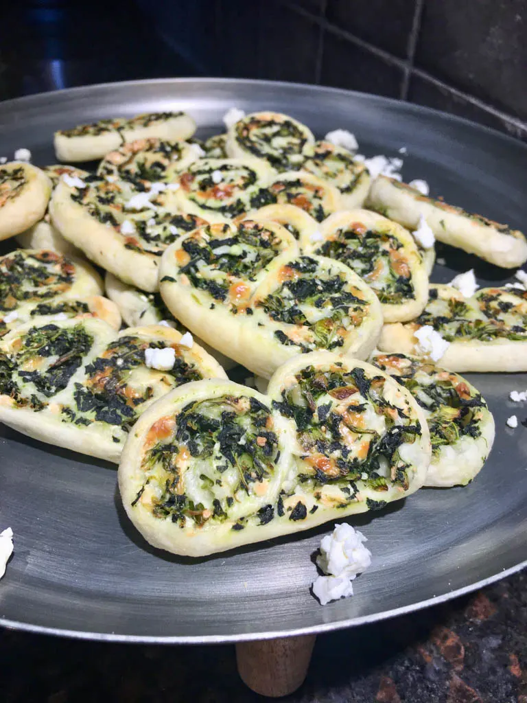 spinach feta palmiers on a metal plate