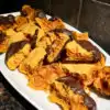 chocolate dipped sponge toffee on a white serving platter