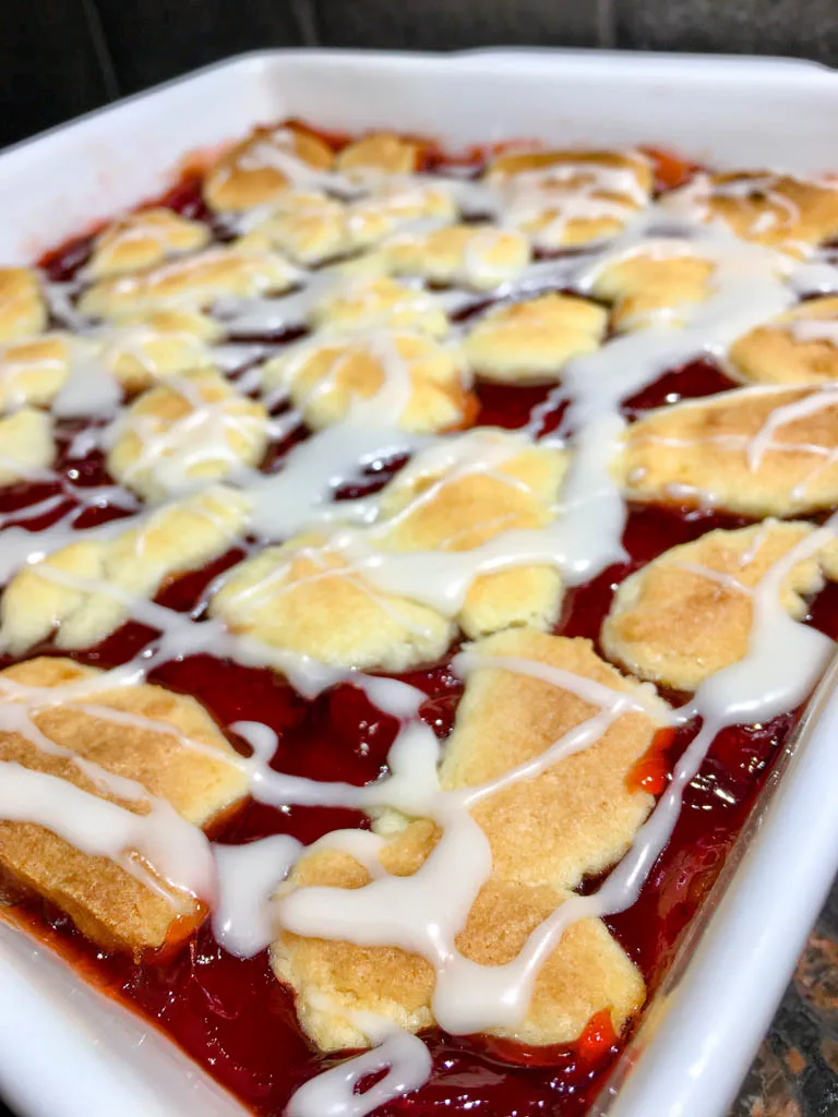 strawberry shortbread bars in a white baking dish