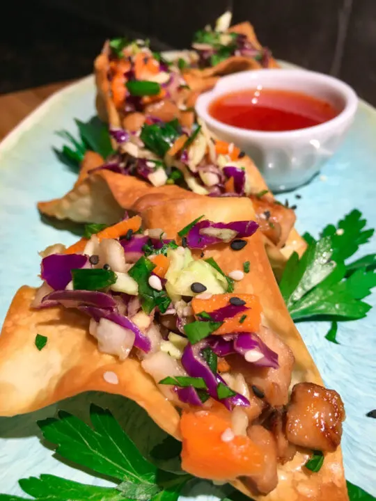 Sweet Chili Chicken Wonton Tacos on a blue plate