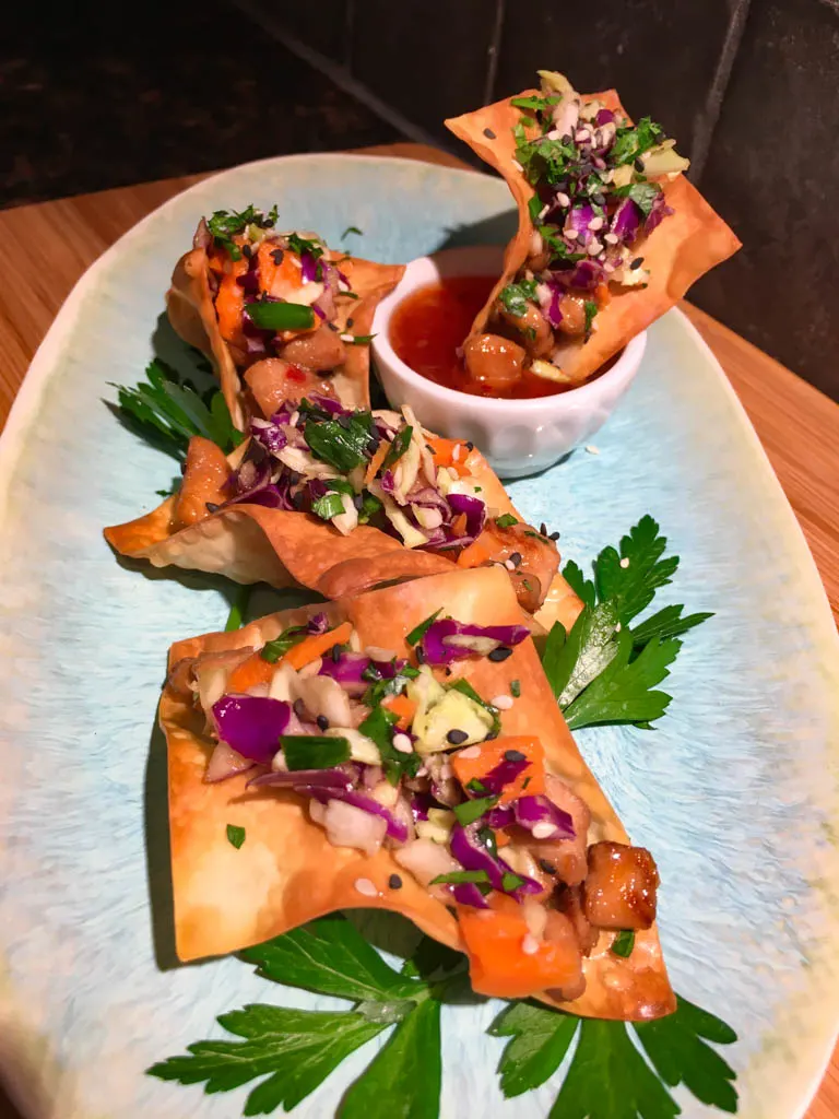 Sweet Chili Chicken Wonton Tacos on a blue plate