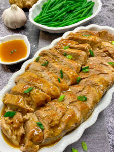Instant Pot Honey Garlic Pork Tenderloin Recipe The Best sliced and served in a white platter
