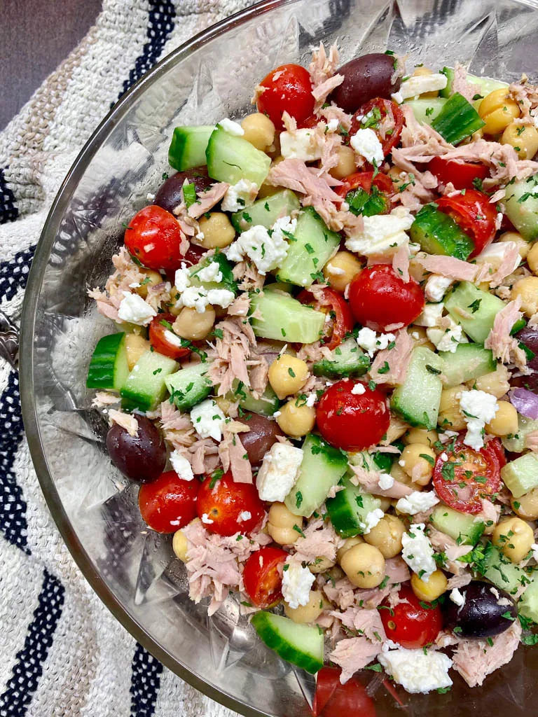 greek chickpea tuna salad in a glass bowl