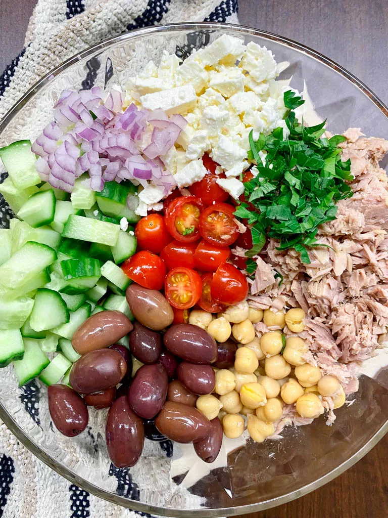 greek chickpea tuna salad in a glass bowl