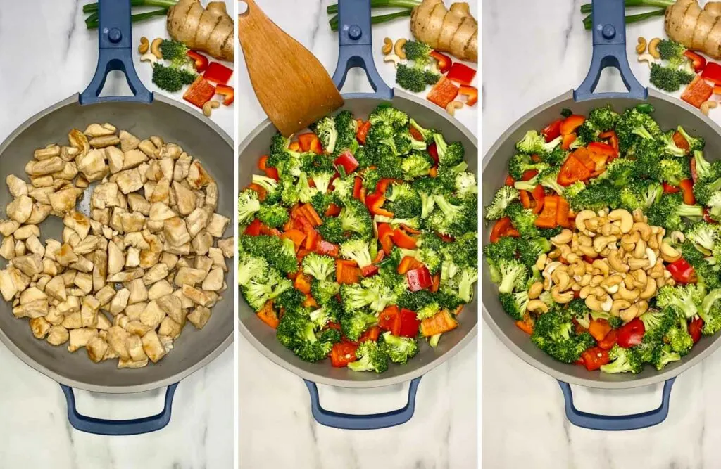 stir frying cashew chicken in a blue and gray frying pan