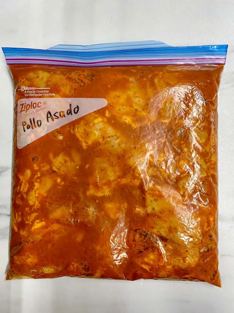 marinated chipotle copycat pollo asado in a ziploc bag