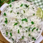 white bowl with cilantro lime rice chipotle copycat recipe and a green checkerboard towel