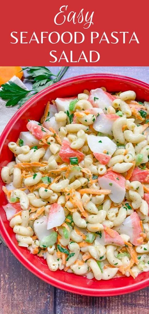 seafood pasta salad in a red bowl