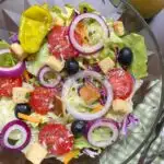 copycat olive garden salad in a glass bowl