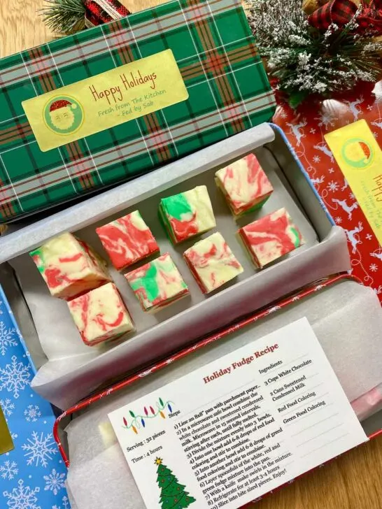 3 holiday gift boxes with holiday swirl fudge, gold foil labels and recipe cards