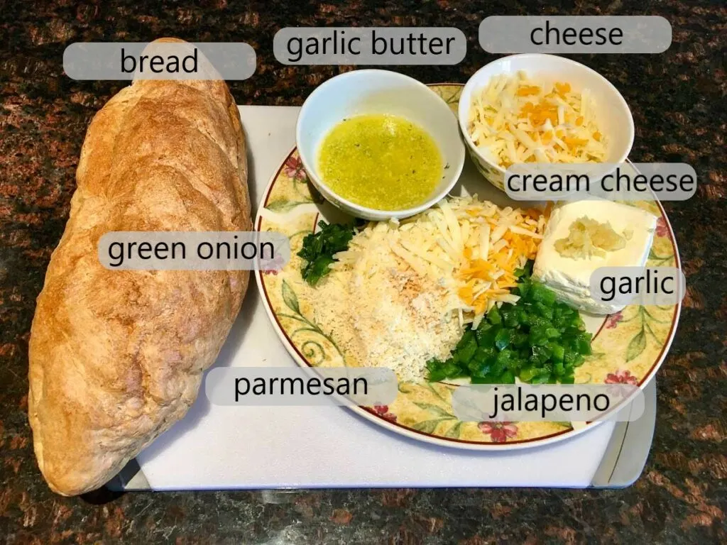 bowls with bread, green onion, garlic butter, cheese, cream cheese, jalapeno and parmesan to make pull apart garlic bread