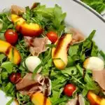 peach caprese salad on a platter