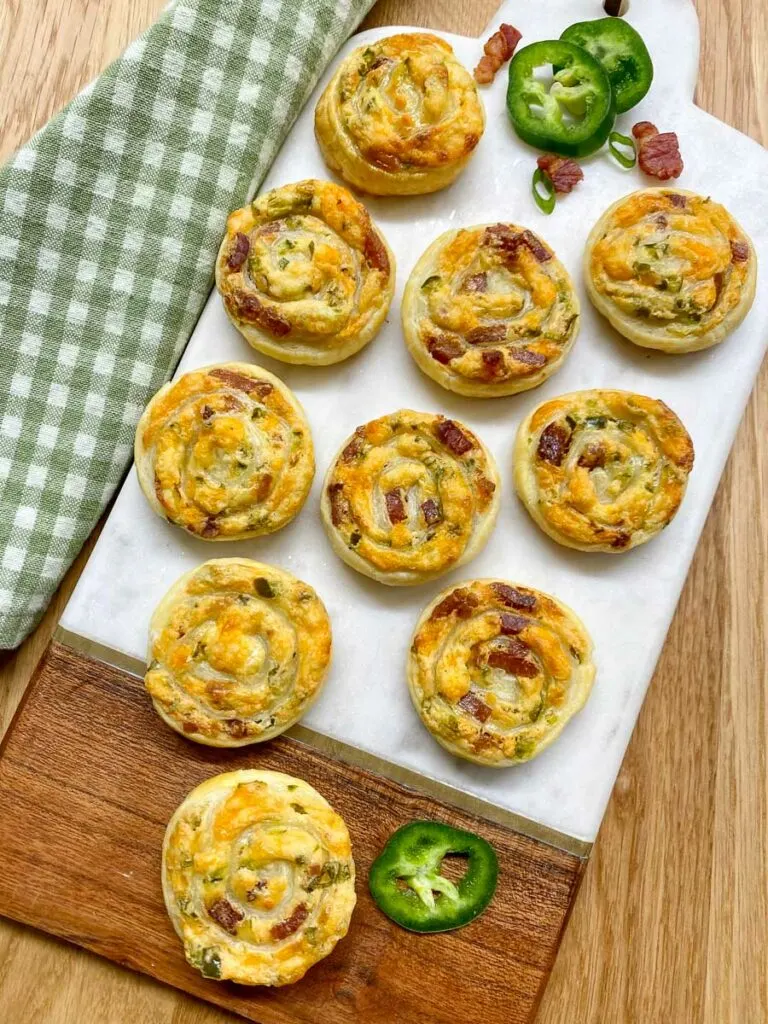 jalapeno popper pinwheels on a serving board