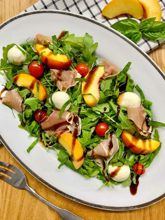 peach caprese salad on a platter