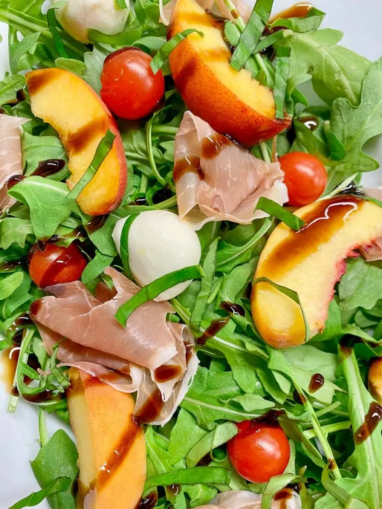 peach caprese salad on a platter