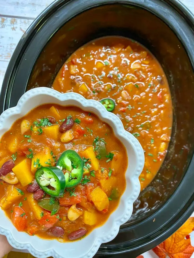 slow cooker butternut squash chili in a bowl and slow cooker