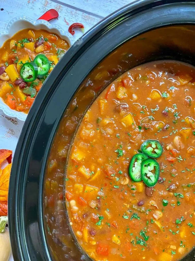 slow cooker butternut squash chili in a bowl and slow cooker