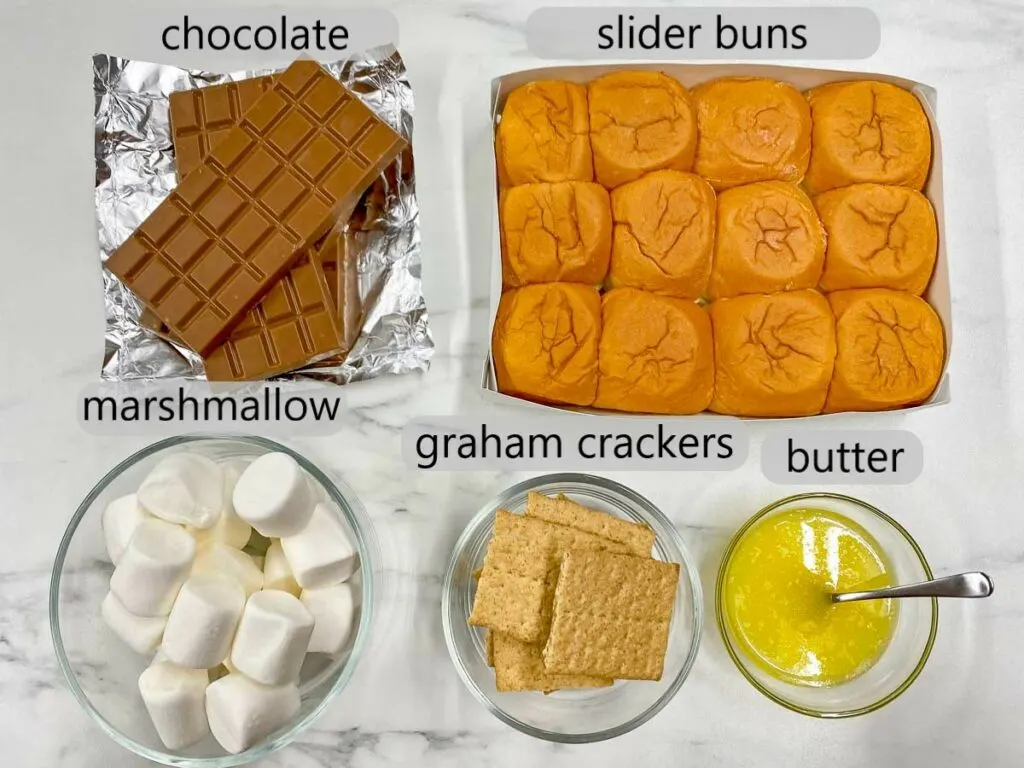 chocolate, slider buns, marshmallows, graham crackers and butter. the ingredients to make s'more sliders