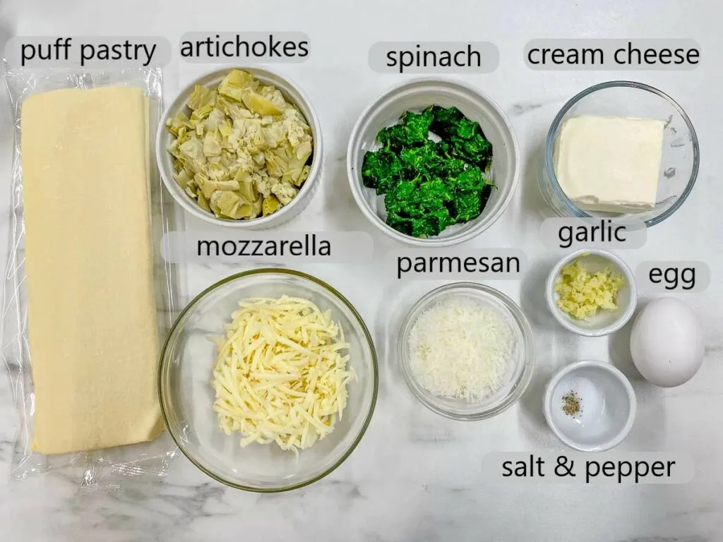 bowls with artichokes, spinach, cream cheese, mozzarella, parmesan, garlic, egg, salt & pepper to make spinach artichoke dip bites