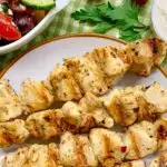 chicken souvlaki on a white plate