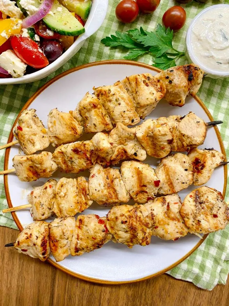 chicken souvlaki on a white plate