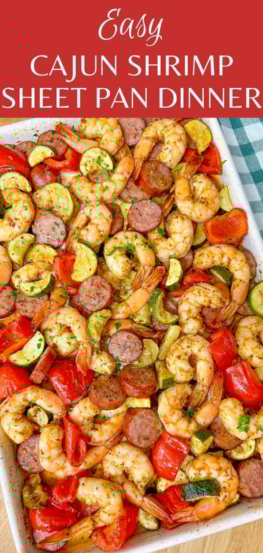 a white sheet pan is filled with a Cajun shrimp and sausage sheet pan bake on a wood counter top. the title of the recipe is written over the image 'easy Cajun shrimp sheet pan dinner'