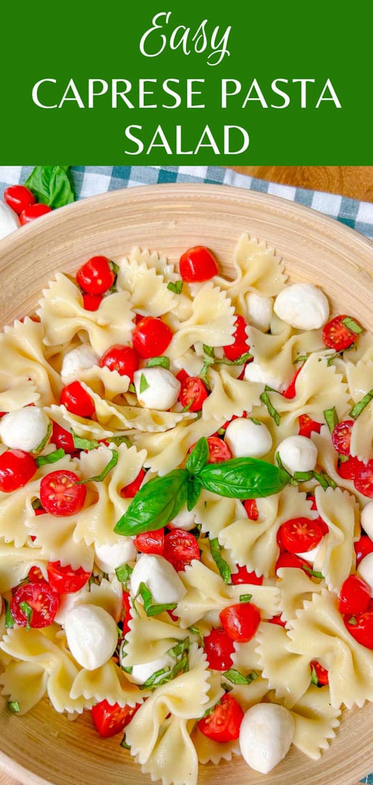 a wooden bowl is filled with caprese pasta salad and garnished with fresh basil. the recipe name is shown on top ' easy caprese pasta salad'