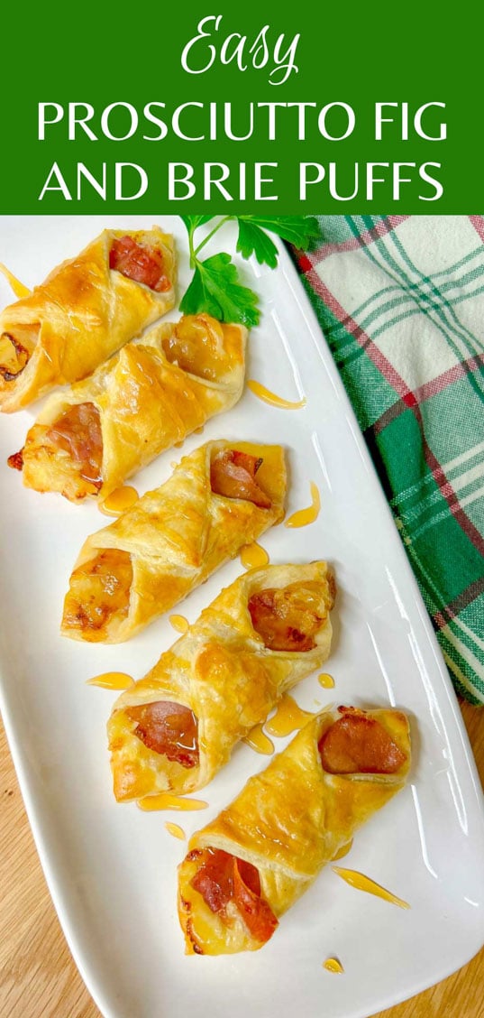 a white platter had prosciutto wrapped brie and fig puffs and they are drizzled with honey